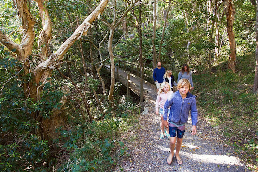 Family walking along one of the many bush walking trails in the Macleay Valley