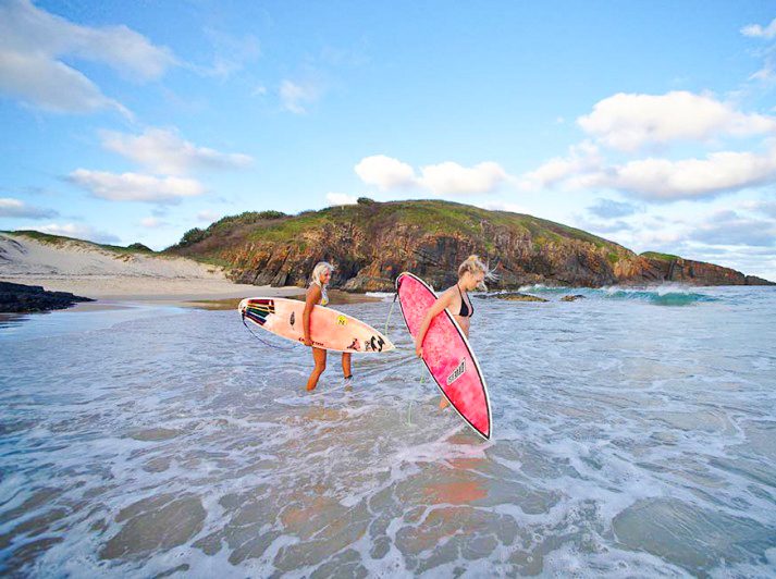 Two female surfers going for a surf at Crescent Head