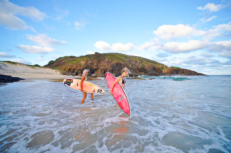 Two female surfers going for a surf at Crescent Head
